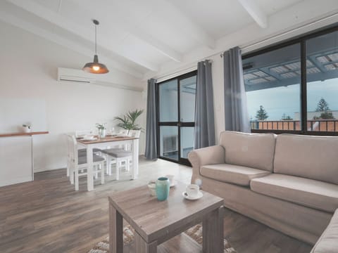 Relax in your open concept apartment that steps out  to the tree top views facing west to the Indian Ocean