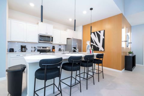 Cook up family favorites in a chef-inspired kitchen with stainless steel appliances and granite countertops.