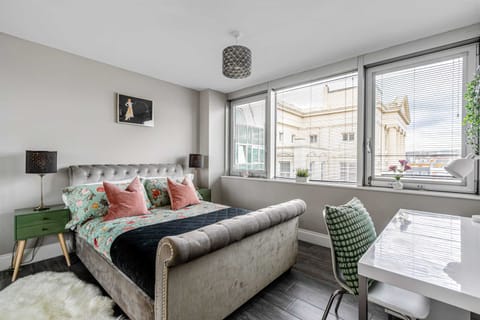 Wake up to sunny skies and city views from your dreamy king bed