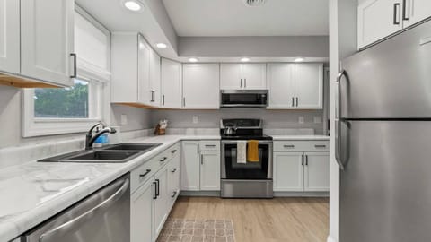 Cook with ease in this well equipped kitchen complete with stainless steel appliances, an electric stove and all the essentials you need. 