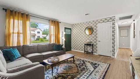 Relax in style in this mid-century modern living room featuring a sectional that is perfect for lounging or gathering. 
