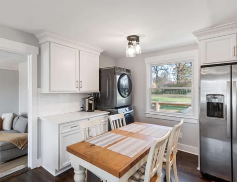 Dining and kitchen space with laundry area