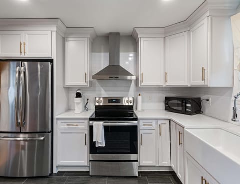 The open, airy kitchen offers ample space & every home comfort