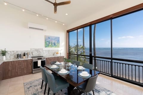 Open concept dining and kitchen with views.