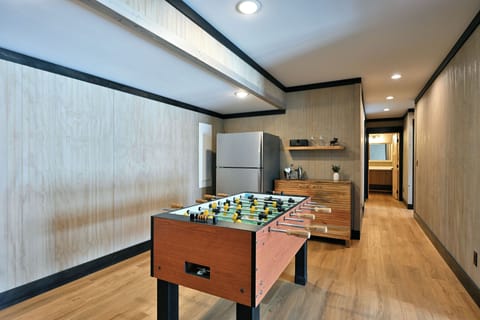 Foosball table, extra refrigerator/freezer and bar area