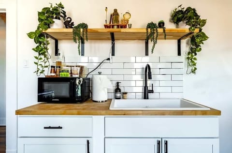 whether it’s breakfast or cocktails, this kitchen is ready for it all  includes blender, coffee maker & more