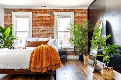 this plant-filled bedroom is a guest favorite for comfort & design  recharge in style after exploring the city