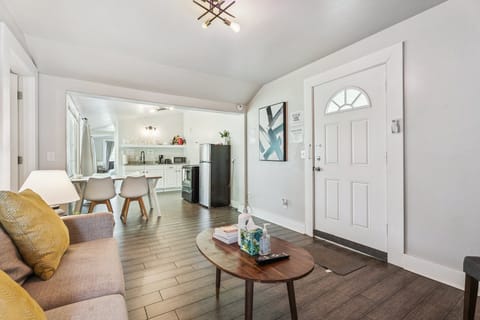 This inviting space flows naturally into the kitchen and dining area—perfect for relaxing or hosting a meal.