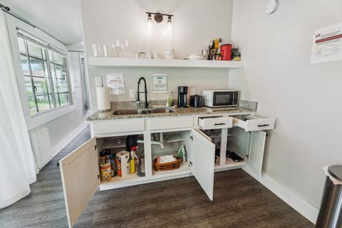 We’ve thought of the little things: pots, pans, cleaning supplies, and even an iron—neatly tucked away for your use.