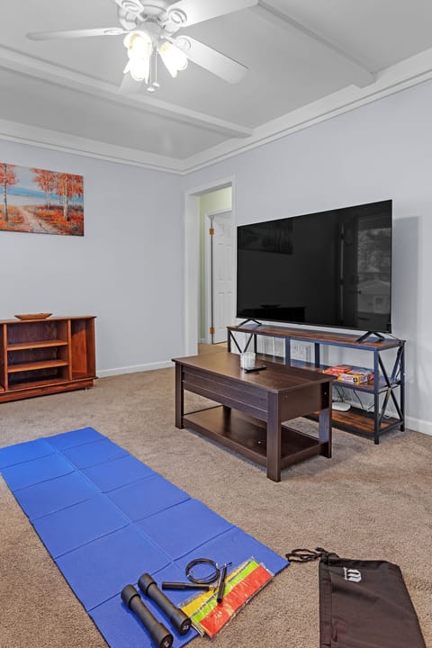 Living room with available exercise equipment 
