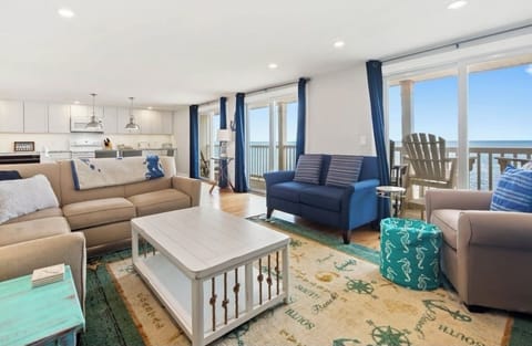 Upper level open concept entertainment area with beautiful views of Cape Cod Bay
