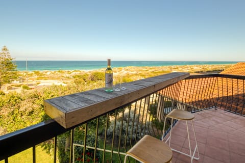 Relax with a drink on your private balcony, taking in sweeping Scarborough Beach views.
