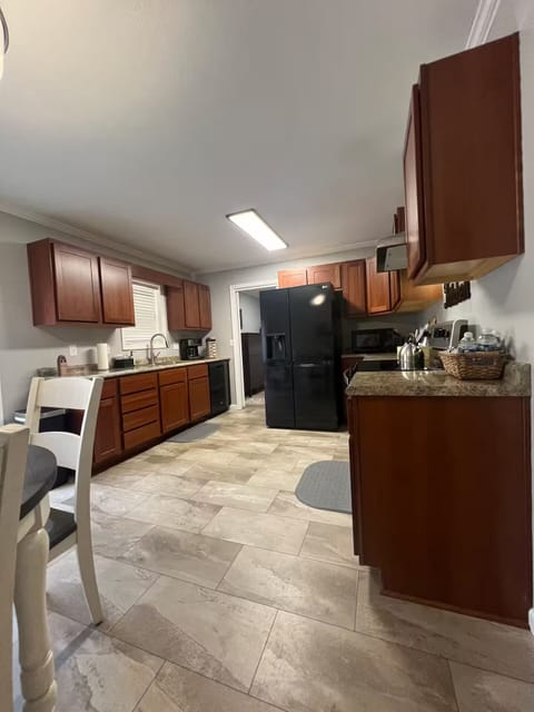 There a large fully stocked kitchen. Everything you need to prepare meals.