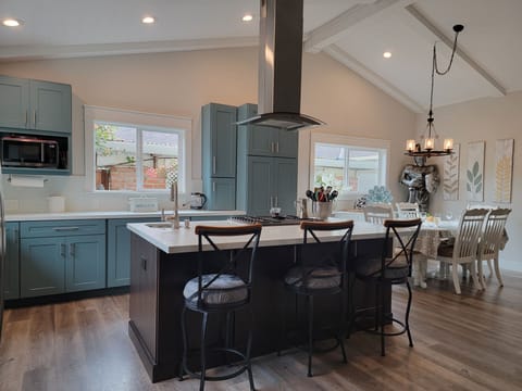 Kitchen island with prep sink and island seating for 3