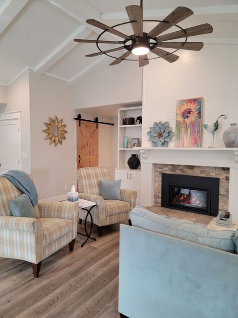 Living room with 2 recliner chairs, sofa and gas fireplace