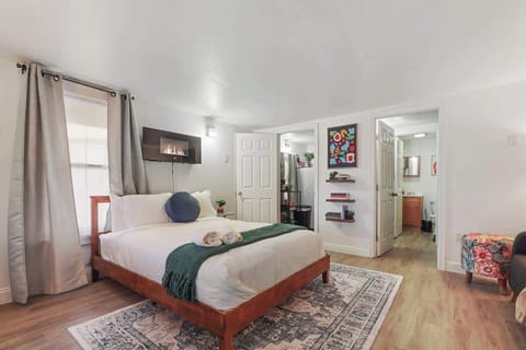 Bright, stylish studio with a cozy queen bed, modern décor, and an updated bathroom.