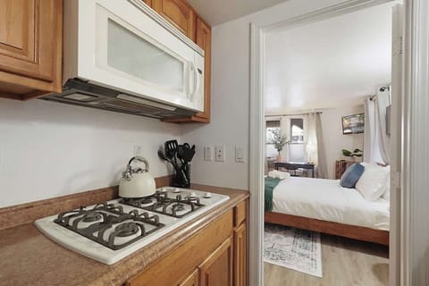 Compact kitchen with essential appliances and a simple setup for easy meal prep.
