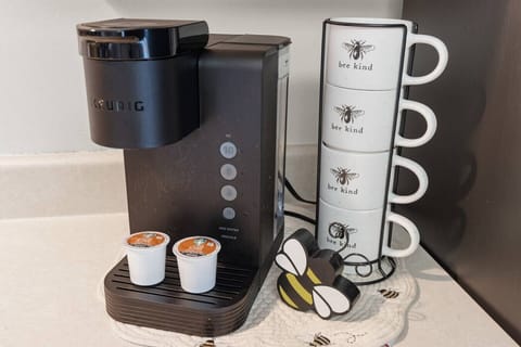 A Keurig is also provided for additional coffee options, along with branded mugs and starter kits.