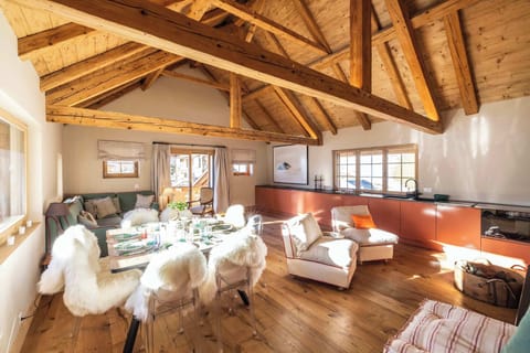 The stunning living room features an open kitchen.