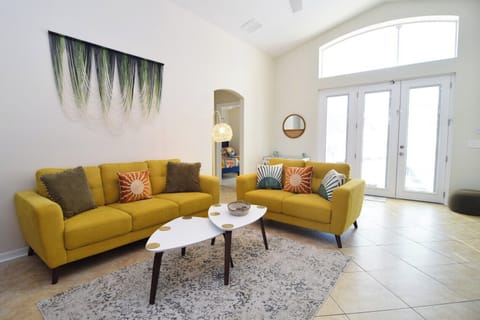 Beautiful open-plan living space, Smart TV, ceiling fan, doors to pool