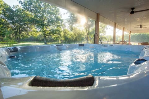 8 person hot tub, 3 steps to get in and out with railing, watch the sunrise or bring your streaming login and watch your favorite shows from this amazing spot on the farm!