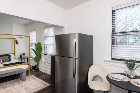 Bed, Refrigerator, and Dining Nook