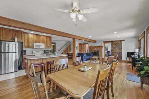 Open-concept living, dining, and kitchen space with ample natural light, and seamless flow perfect for gathering and entertaining.