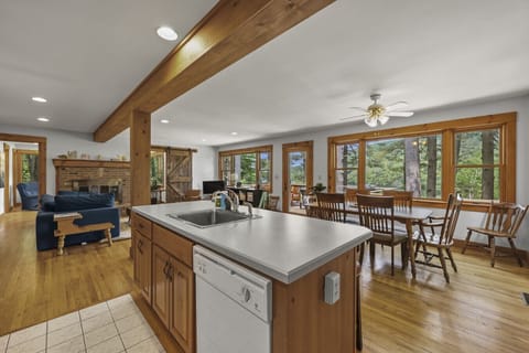 Kitchen and dining nook view showing ample counter space and cozy, warm finishes.