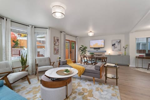 Bright, modern, and designed for connection—relax in this stylish open-concept living space that blends comfort with mid-century charm