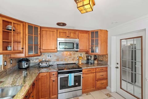 The fully equipped kitchen with top-of-the-line stainless steel appliances is perfect for preparing meals and entertaining #NaplesEscape