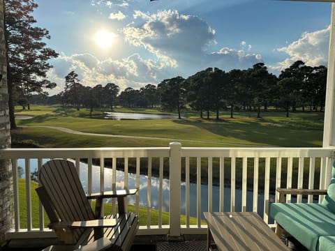 Porch w/  seating, ceiling fan and view of 4th hole 