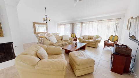 Open floor plan and sliding glass doors throughout the living and dining