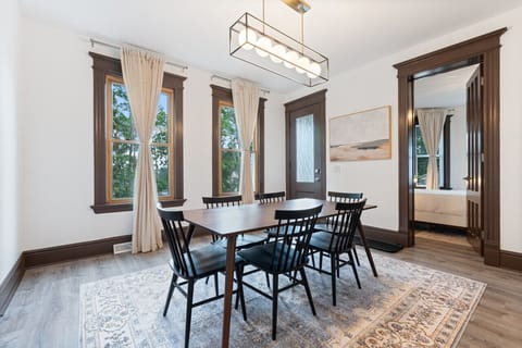 Enter through the covered porch into our elegant dining room, adorned with modern lighting and classic trim. Bathed in natural light, it`s perfect for gatherings from casual breakfasts to formal dinners, designed to create lasting memories.