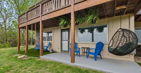 Lower patio with swings over looking a scenic view. 
