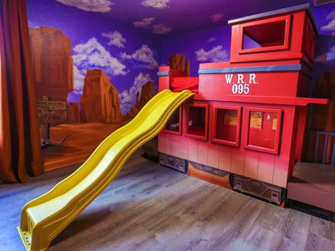 Toy Story train bunk room with slide — the room kids will talk about all trip