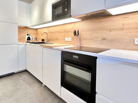 Countertop, Flooring, Kitchen, Cabinetry, Wood, Interior Design, Kitchen Appliance, Floor, Major Appliance, Furniture