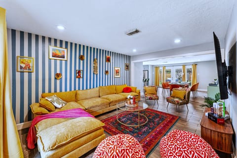 F.R.I.E.N.D.S.-themed living room with plush couch