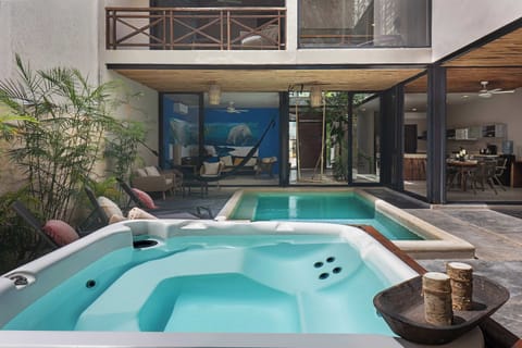 Backyard of the property with jacuzzi and pool