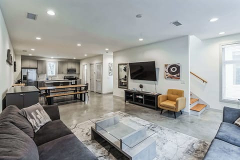 Curl up in the chic living room & stream your favorites on the smart TV