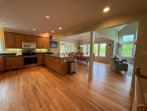 open concept kitchen/ dining/ living room