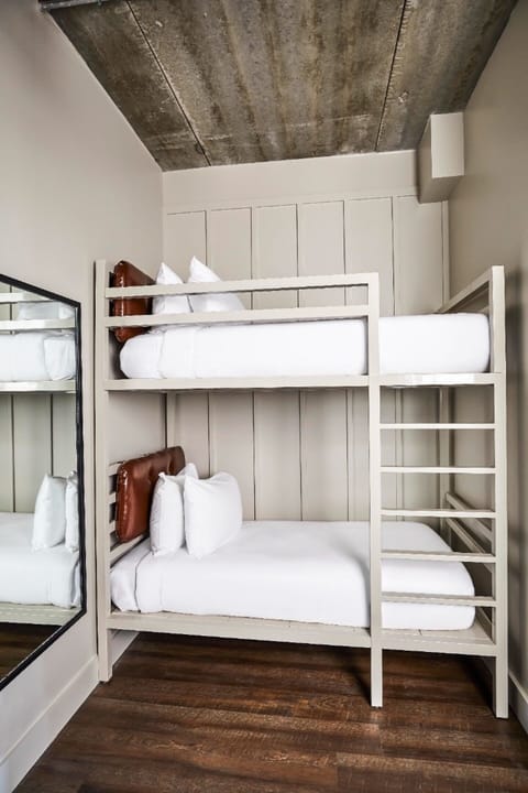 Sleep soundly in cozy bunks with crisp hotel linens.