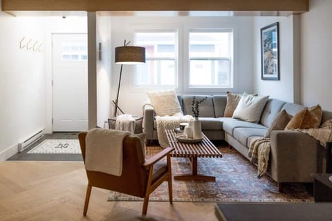 Cozy Comfort: Unwind in Our Comfy Living Room, Perfect for Relaxing After a Day of Exploring. #RelaxAtHome #AtQVStage