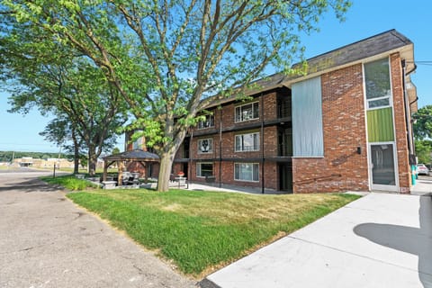 The inviting front yard features manicured lawns and clearly defined walkways.