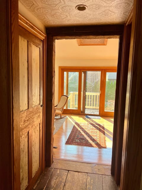 Afternoon light floods the kitchen & sitting area.