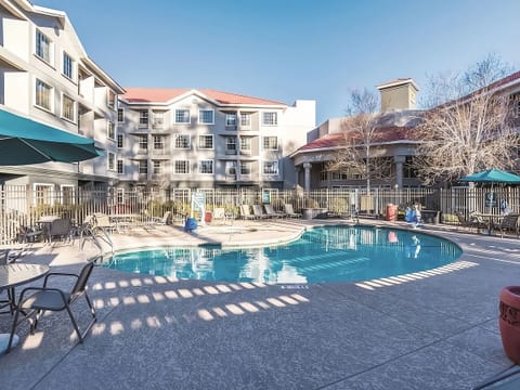 Dive into sunlit relaxation with spacious poolside lounging.
