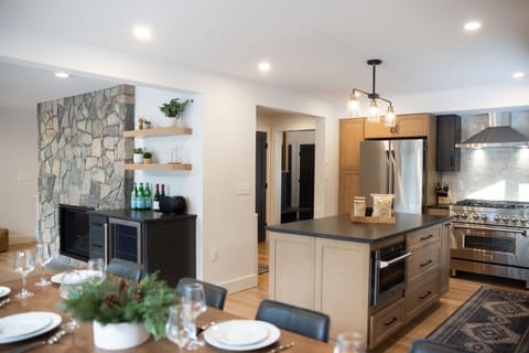 Modern open kitchen with large island, luxury appliances, and everything you need to cook and gather