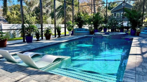 Fully screened area with pool and hot tub