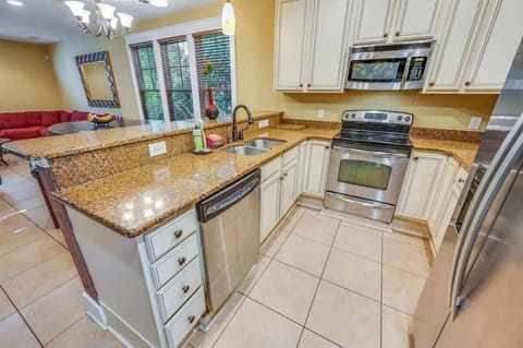 - Fully equipped kitchen with stainless steel appliances and spacious countertops - Enjoy preparing meals with plenty of storage, modern amenities, & a welcoming layout - Overlooking the living area, it's perfect for cooking while staying connected
