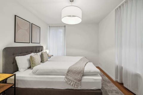 Sleeping area furnished with a queen-size bed and bedside tables