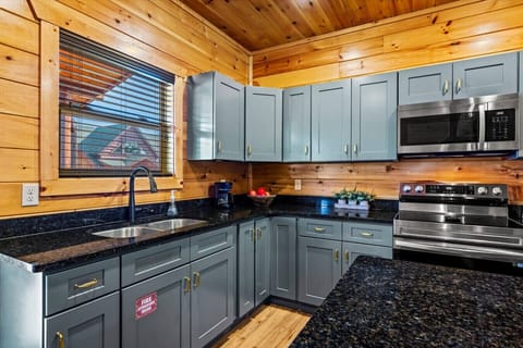 This well-equipped kitchen combines modern appliances with charming cabin style—everything you need to prepare meals during your stay.